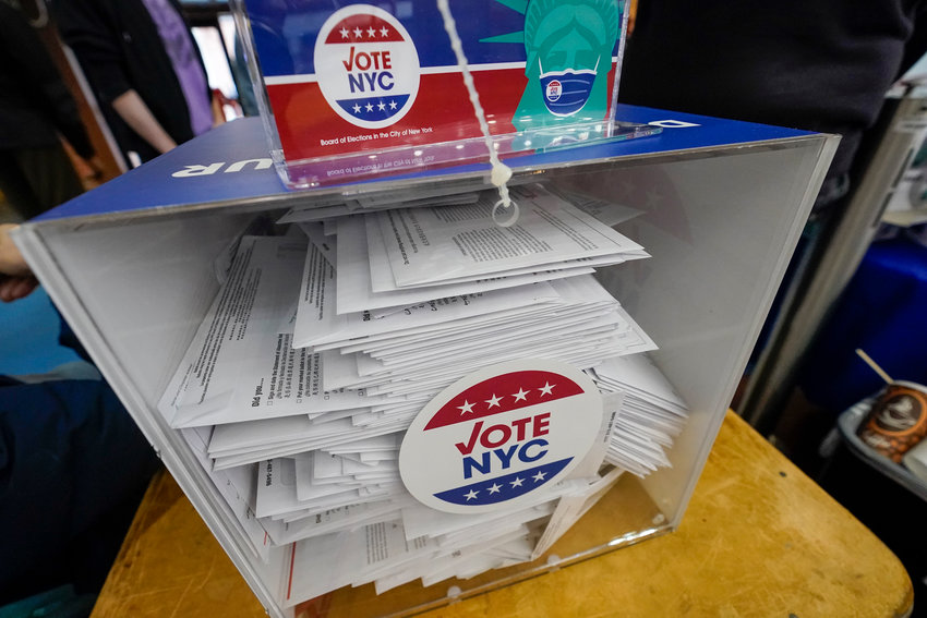 Absentee ballots are seen in a locked ballot box during early voting at the Park Slope Armory YMCA, Tuesday, Oct. 27, 2020, in the Brooklyn borough of New York. (AP Photo/Mary Altaffer)