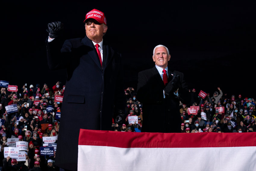 President Donald Trump and Vice President Mike Pence arrive for a campaign rally at Cherry Capital Airport, Monday, Nov. 2, 2020, in Traverse City, Mich. (AP Photo/Evan Vucci) ..