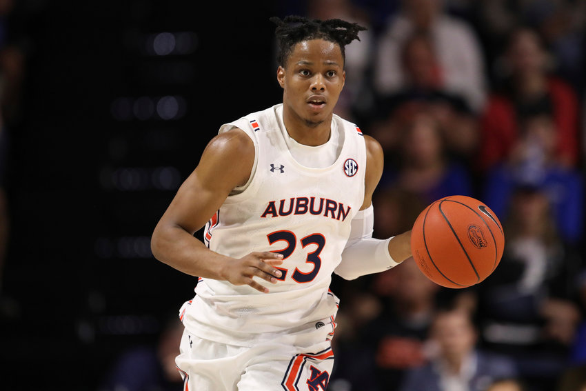Auburn forward Isaac Okoro (23) dribbles up court against Florida during the first half of an NCAA college basketball game Saturday, Jan. 18, 2020, in Gainesville, Fla. (AP Photo/Matt Stamey)