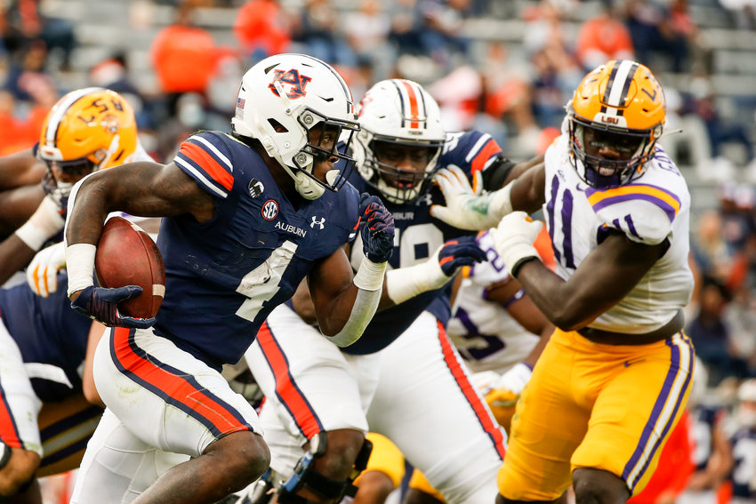 Auburn running back Tank Bigsby (4) carries the ball during the second quarter of an NCAA college football game against LSU, Saturday, Oct. 31, 2020, in Auburn, Ala. (AP Photo/Butch Dill)