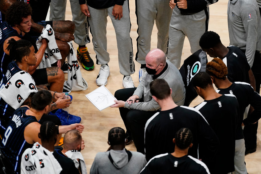 Orlando Magic coach Steve Clifford talks to players during a timeout in the first half of the team's NBA preseason basketball game against the Atlanta Hawks on Friday, Dec. 11, 2020, in Atlanta. (AP Photo/John Bazemore)