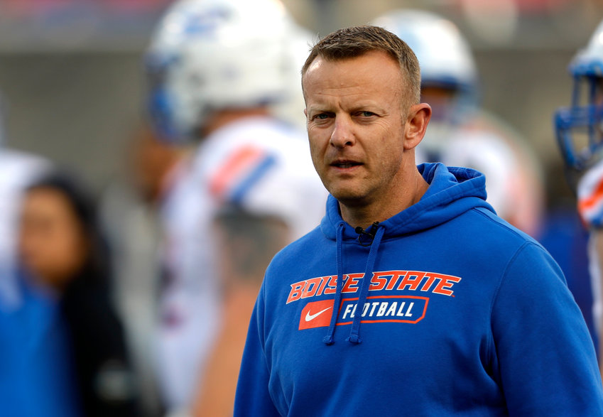FILE - In this Saturday, Dec. 21, 2019 file photo, Boise State coach Bryan Harsin watches his players warm up for the Las Vegas Bowl NCAA college football game against Washington at Sam Boyd Stadium in Las Vegas. No. 25 San Jose State will face perennial conference powerhouse Boise State in the Mountain West championship on Saturday, Dec. 19, 2020 in Las Vegas. The game is usually played on the higher seed&rsquo;s home field but this year it will be held at Sam Boyd Stadium.  (AP Photo/Steve Marcus, File)