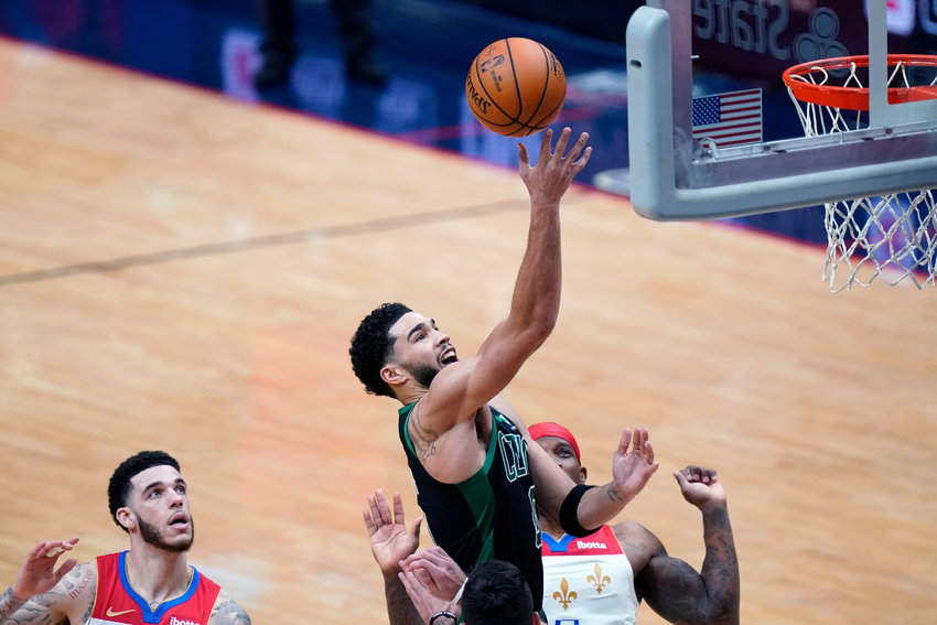 Boston Celtics forward Jayson Tatum (0) goes to the basket in the second half of an NBA basketball game against the New Orleans Pelicans in New Orleans, Sunday, Feb. 21, 2021. (AP Photo/Gerald Herbert)