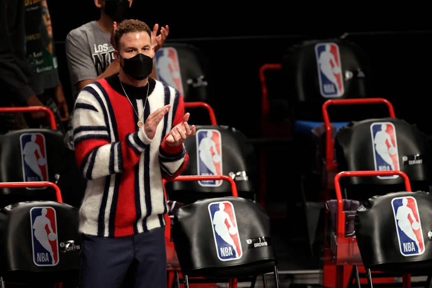 Brooklyn Nets Blake Griffin cheers on his team against the Boston Celtics during the first half of an NBA basketball game, Thursday, March 11, 2021, in New York. (AP Photo/Adam Hunger)