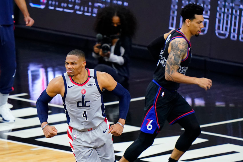 Washington Wizards' Russell Westbrook, left, reacts past Philadelphia 76ers' Danny Green after a dunk during the first half of Game 2 in a first-round NBA basketball playoff series, Wednesday, May 26, 2021, in Philadelphia. (AP Photo/Matt Slocum)