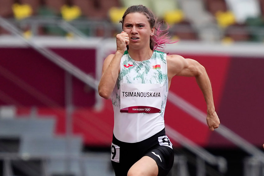 Athlete Krystsina Tsimanouskaya of Belarus competes during the 100 meter heats at the 2020 Summer Olympics, Monday, Aug. 2, 2021, in Tokyo. (AP Photo/Martin Meissner)