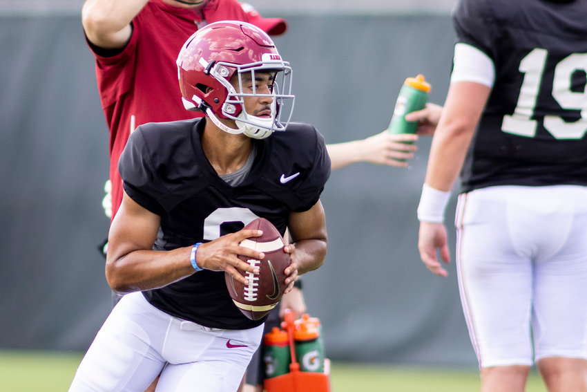Alabama quarterback Bryce Young (9) rolls out on a passing drill at Alabama&rsquo;s fall camp football practice, Thursday, Aug. 12, 2021, in Tuscaloosa, Ala. The team allowed media a window to see individual drills. (AP Photo/Vasha Hunt)