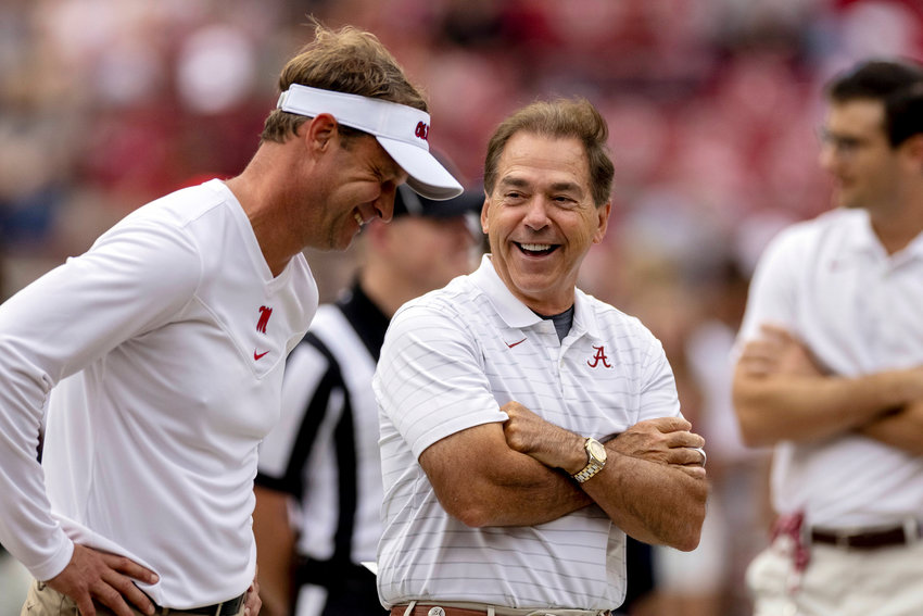 Mississippi head coach Lane Kiffin and Alabama head coach Nick Saban share a laugh as they meet in the middle of the field in warm-ups before an NCAA college football game, Saturday, Oct. 2, 2021, in Tuscaloosa, Ala. (AP Photo/Vasha Hunt)