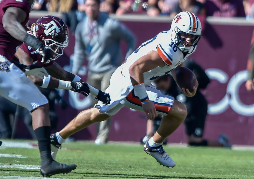 Auburn Tigers quarterback Bo Nix (10) scrambles during the first half of Saturday&rsquo;s NCAA football game, at Kyle Field in College Station TX.