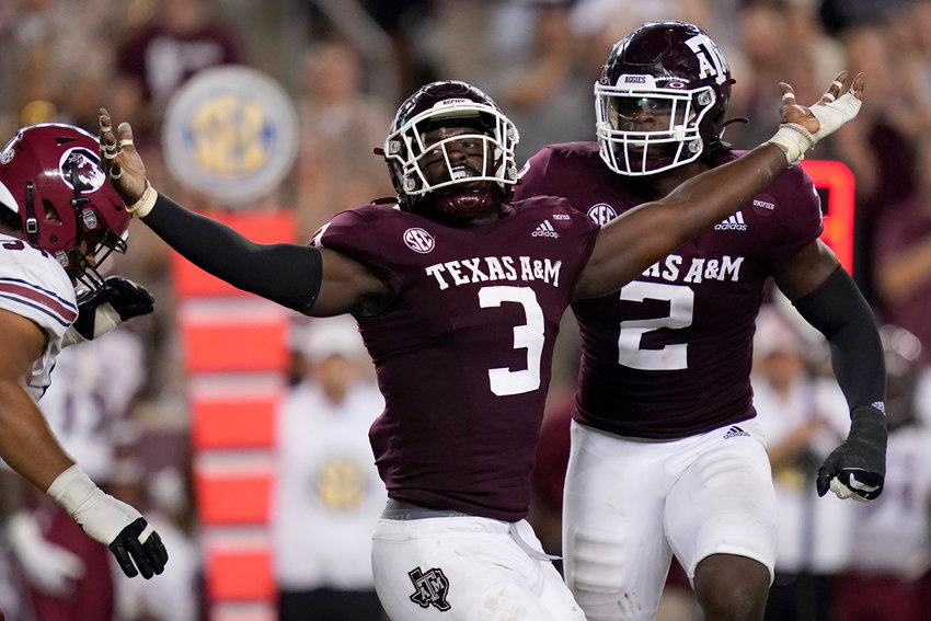 Texas A&amp;M defensive lineman Tyree Johnson (3) reacts after sacking South Carolina quarterback Zeb Noland (8) for a loss of six yards by during the first half of an NCAA college football game on Saturday, Oct. 23, 2021, in College Station, Texas. (AP Photo/Sam Craft)