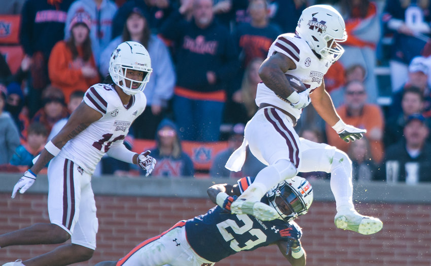 Auburn Tigers cornerback Roger McCreary (23) dives at Mississippi State Bulldogs running back Dillon Johnson (23) during the second half of Saturday&rsquo;s NCAA football game, at Jordan-Hare Stadium in Auburn.