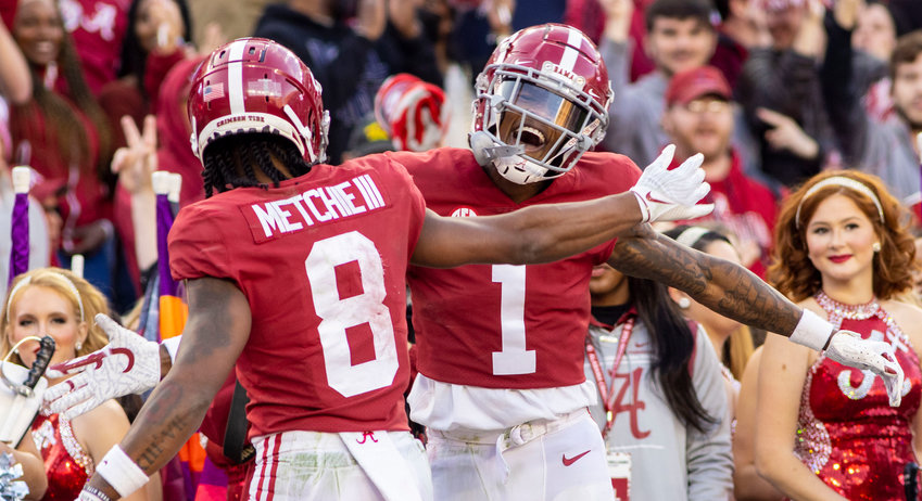 Alabama wide receiver Jameson Williams (1) celebrate this second touchdown reception of the game with wide receiver John Metchie III (8) during the first half of an NCAA college football game, Saturday, Nov. 20, 2021, in Tuscaloosa.