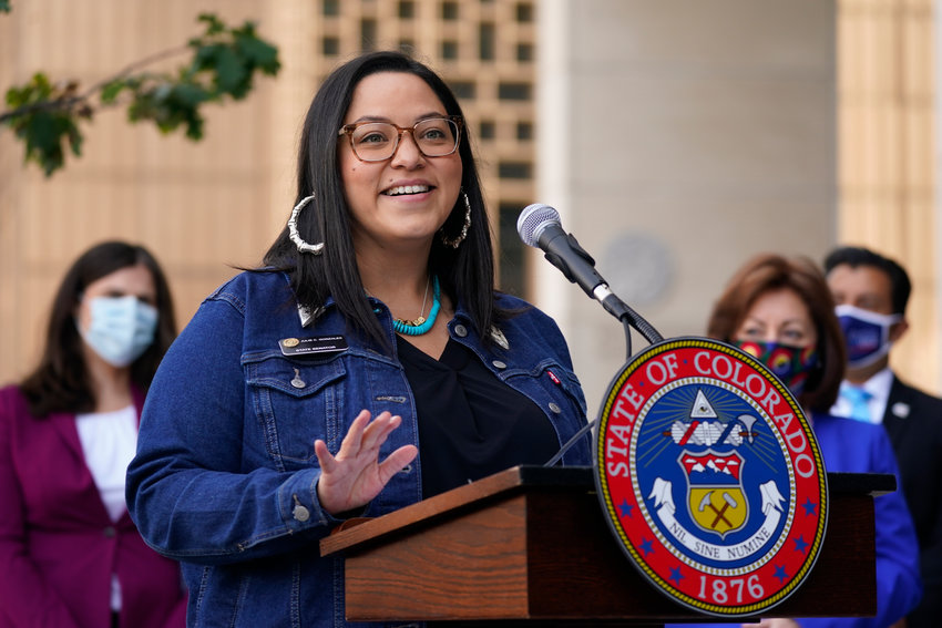 FILE - Colorado State Sen. Julie Gonzales speaks during a news conference on Oct. 15, 2020, in Denver. According to an analysis by The Associated Press, at least 18 states refer to immigrants as &quot;alien&quot; or &quot;illegal&quot; in state laws. In a March 2021 legislative committee hearing in Colorado, Gonzales, who co-sponsored a bill that has since become law, said terms like &quot;illegal&quot; were &quot;dehumanizing and derogatory.&quot; (AP Photo/David Zalubowski, File)