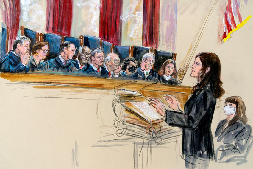 This artist sketch depicts Center for Reproductive Rights Litigation Director Julie Rikelman speaking to the Supreme Court, Wednesday, Dec. 1, 2021, in Washington. Seated to Rikelman's right is Solicitor General Elizabeth Prelogar.  Justices seated from left are Associate Justice Brett Kavanaugh, Associate Justice Elena Kagan, Associate Justice Samuel Alito, Associate Justice Clarence Thomas, Chief Justice John Roberts, Associate Justice Stephen Breyer, Associate Justice Sonia Sotomayor, Associate Justice Neil Gorsuch and Associate Justice Amy Coney Barrett. (Dana Verkouteren via AP)