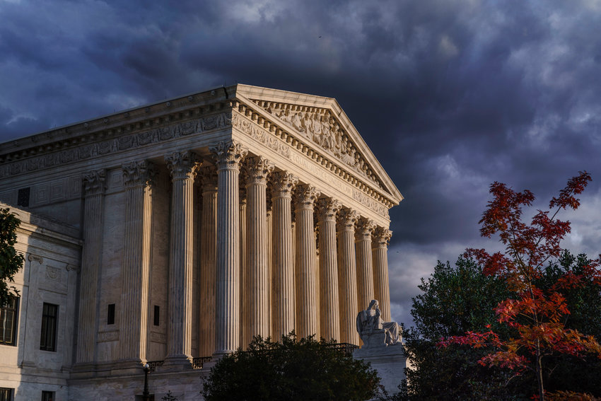 The Supreme Court is seen at dusk in Washington, Friday, Oct. 22, 2021. The justices have allowed a Texas law that bans most abortions to remain in effect for now, but they want to hear arguments on Nov. 1 will help the justices decide whether the law should be blocked while legal challenges continue. (AP Photo/J. Scott Applewhite)