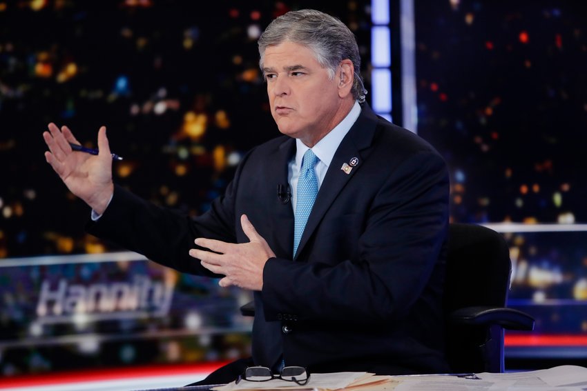 FILE - Fox News host Sean Hannity speaks during a taping of his show, &quot;Hannity,&quot; on Aug. 7, 2019, in New York. The revelation that Fox News Channel personalities sent text messages to the White House during the Jan. 6 insurrection urging President Donald Trump to call off the attack is the latest example of the network's stars seeking to influence the actions of newsmakers instead of simply reporting the news.(AP Photo/Frank Franklin II, File)