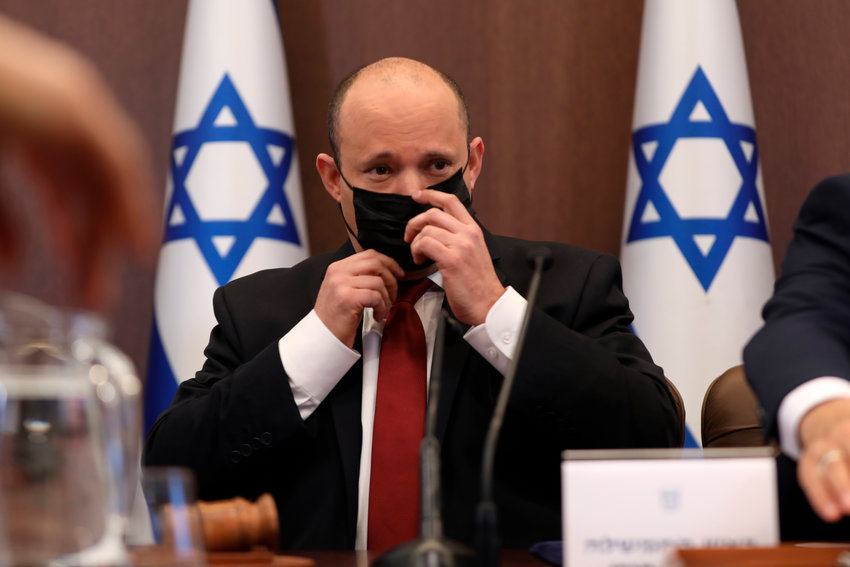 Israeli Prime Minister Naftali Bennett (c) attends a cabinet meeting at the Prime minister's office in Jerusalem, Israel, 19 December 2021.