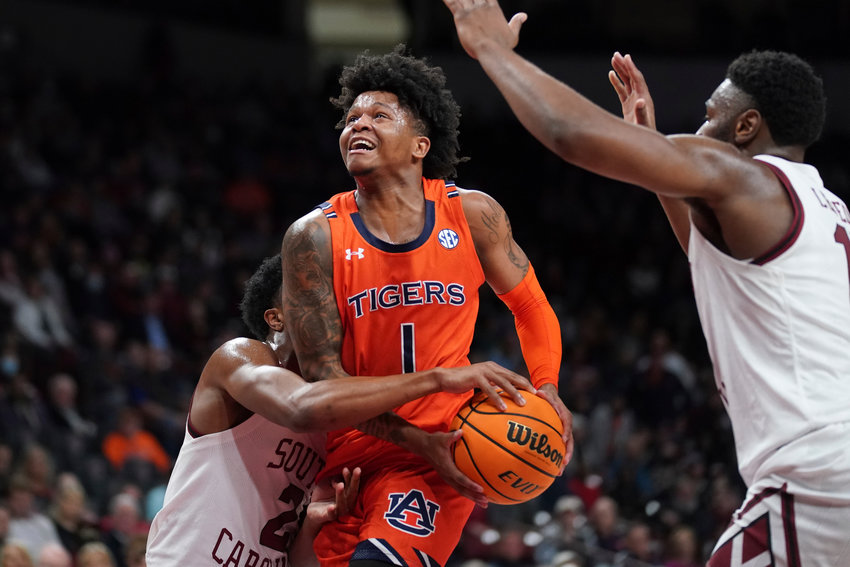 Auburn guard Wendell Green Jr. (1) drives to the hoop against South Carolina guard Chico Carter Jr. (2) during the first half of an NCAA college basketball game Tuesday, Jan. 4, 2022, in Columbia, S.C. Auburn won 81-66. (AP Photo/Sean Rayford)