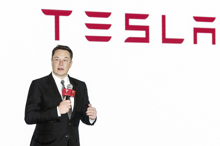 Tesla CEO Elon Musk holds a presser to introduce the auto-driving system upgrade for Chinese Tesla owners in Beijing, China Friday Oct. 23, 2015. Activists on Monday, Jan 3. 2022 are appealing to Elon Musk and Tesla Inc. to close a new showroom in China&rsquo;s northwestern region of Xinjiang, where officials are accused of abuses against mostly Muslim ethnic minorities. (Chinatopix Via AP) CHINA OUT