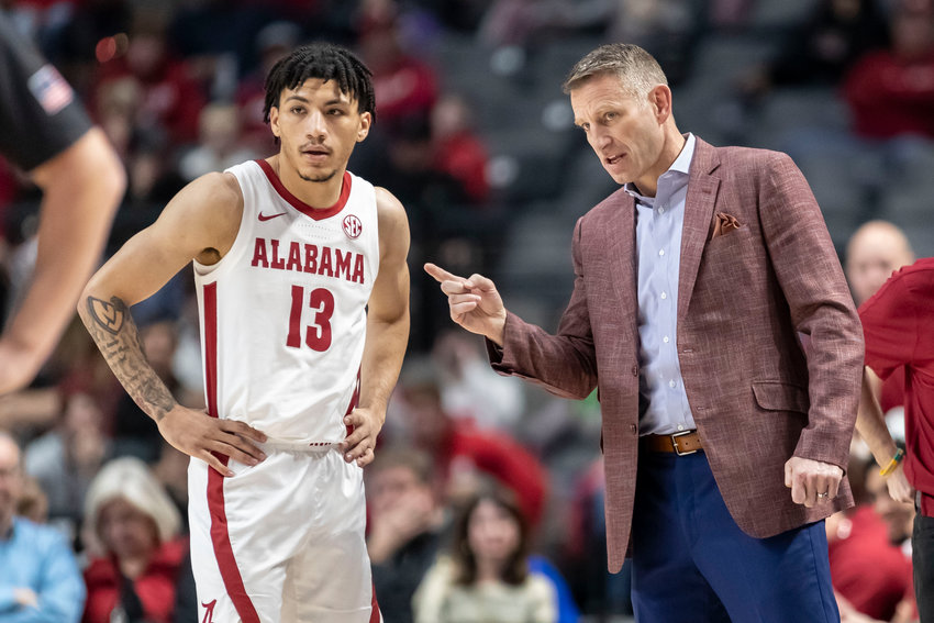 Alabama guard Jahvon Quinerly (13) and Alabama head coach Nate Oats talk during a game this season. The Tide lost to Mississippi State 78-76 in Starkville on Saturday.