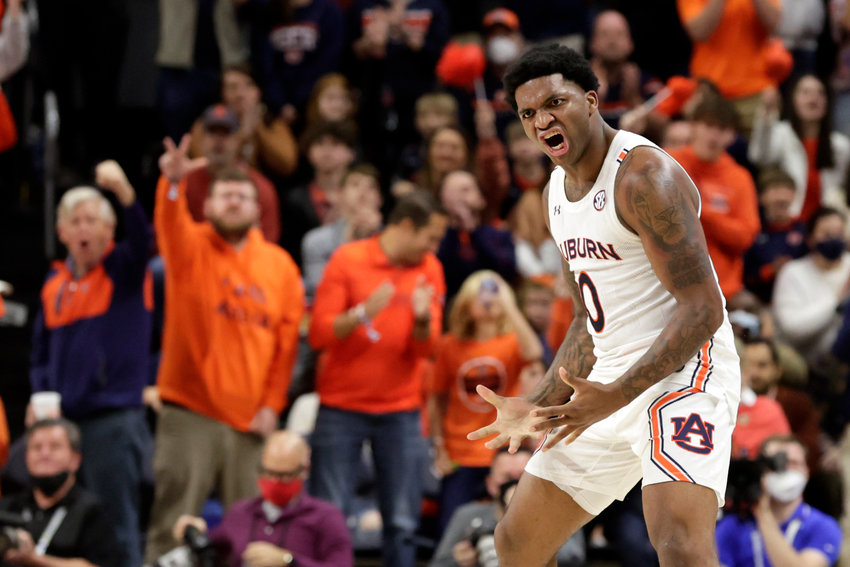 Auburn guard K.D. Johnson (0) reacts after a three pointer against Kentucky during the second half of an NCAA college basketball game Saturday, Jan. 22, 2022, in Auburn, Ala. (AP Photo/Butch Dill)
