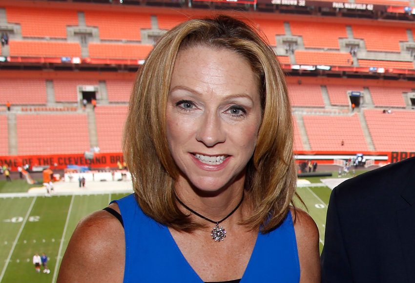 ESPN broadcasters Beth Mowins, left, and Rex Ryan pose in the booth before an NFL football game between the New York Giants and the Cleveland Browns, Monday, Aug. 21, 2017, in Cleveland. (AP Photo/Ron Schwane)