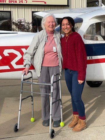 Gabriella White, 19, at right, is greeted by Hilda Ray, Walker County's first licensed female pilot, after White's first solo flight.