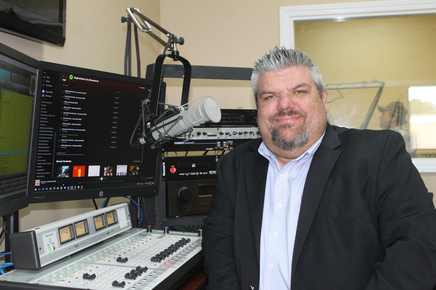 Station owner Brett Elmore sits in the new studios of WJLX. The station recently moved from its longtime home on Highway 195 to Highway 78.