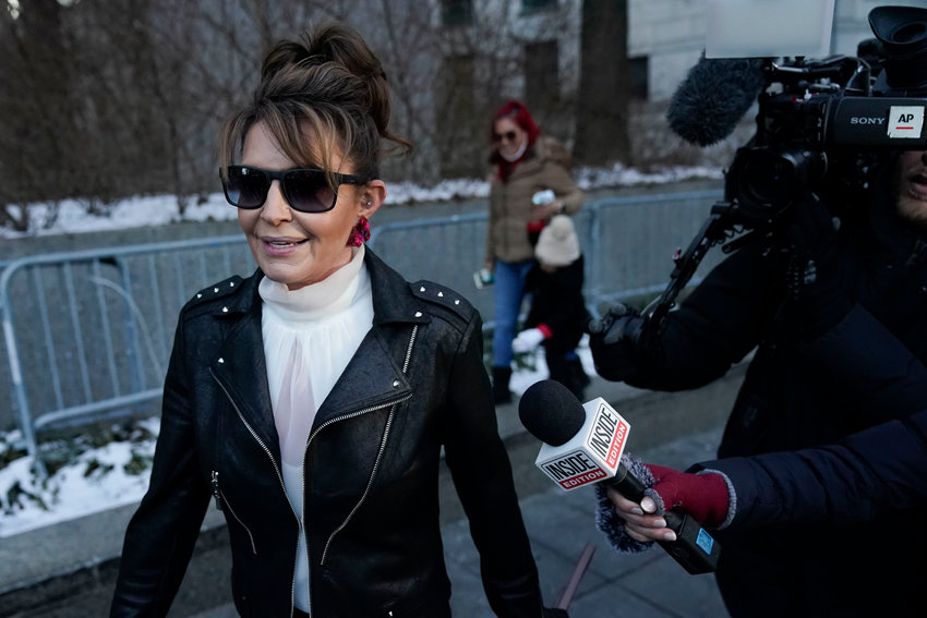 Former Alaska Gov. Sarah Palin leaves a courthouse in New York, Monday, Feb. 14, 2022. A judge said Monday he&rsquo;ll dismiss a libel lawsuit that Palin filed against The New York Times, claiming the newspaper damaged her reputation with an editorial falsely linking her campaign rhetoric to a mass shooting. U.S. District Judge Jed Rakoff made the ruling with a jury still deliberating in the trial where the former Alaska governor and vice-presidential candidate testified last week. (AP Photo/Seth Wenig)