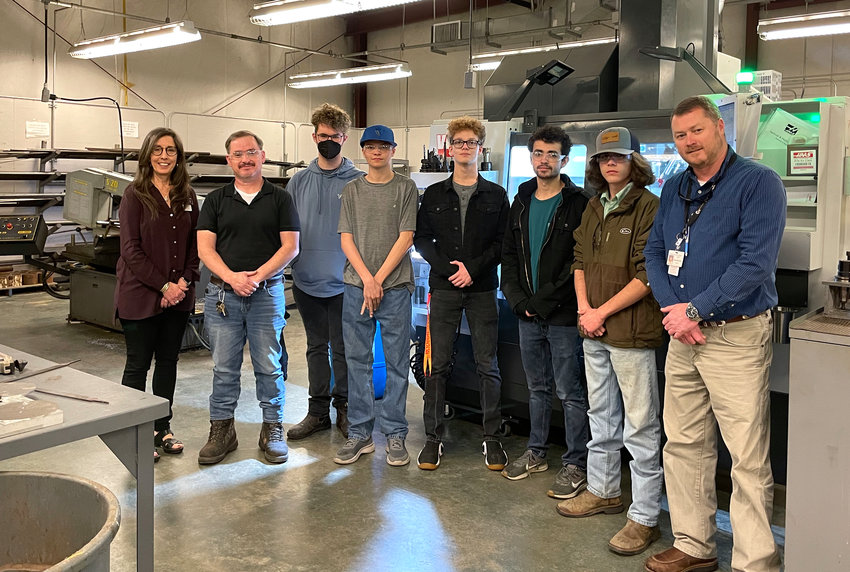 Students in Jasper City and Walker County schools have helped to restore a part of space history. Pictured, from left to right, is Jasper City Schools Career and Technical Education Director Beth Kennedy, precision machining instructor Ted Alexander, some students that participated in the project, and Walker County Center of Technology Director Chris McCullar.