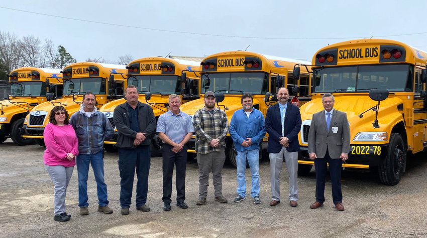 The Walker County school system has purchased 14 new school buses. Members of the maintenance department for school buses are pictured with transportation director Mike Scott, fourth from left, Superintendent Dr. Dennis Willingham, second from right, and chief school financial officer Andy McCay, far right.