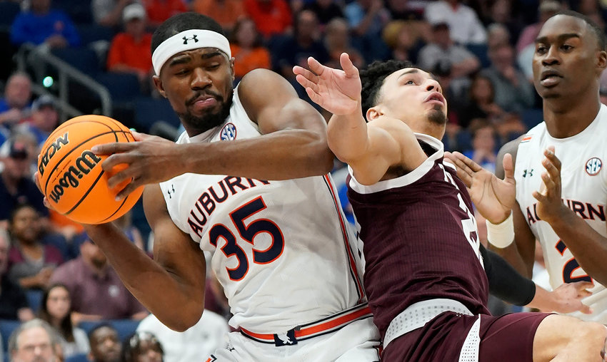 Auburn guard Devan Cambridge (35) grabs a rebound away from Texas A&amp;M guard Andre Gordon (20) during their game in the SEC Tournament on Friday. The Tigers are a No. 2 seed in the NCAA Tournament and play Jacksonville State on Friday.