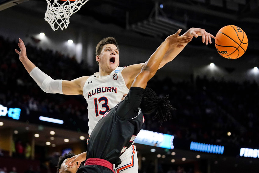 Auburn&rsquo;s Walker Kessler, left, blocks Jacksonville State&rsquo;s Demaree King, right, during the second half of a college basketball game in the first round of the NCAA tournament Friday, March 18, 2022, in Greenville, S.C. (AP Photo/Brynn Anderson)