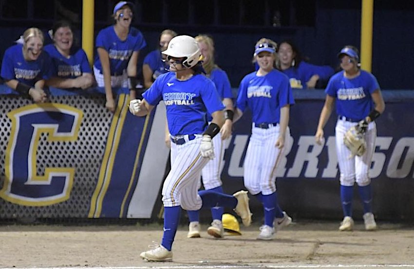 Curry's Kylee Trotter heads home after hitting a two-run home run that gave the Yellow Jackets the lead against Oakman in the county tournament championship game on Friday night.