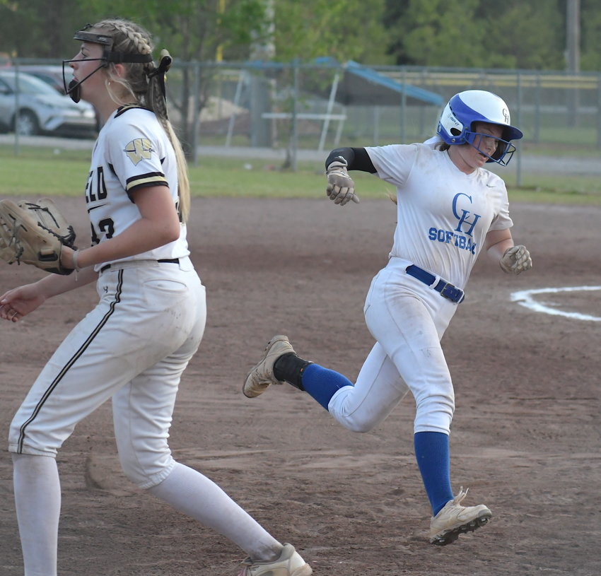 Carbon Hill's Raelea Guy rounds third on her way to home plate during the Bulldogs' loss to Winfield in the Bill Collins Tournament championship game on Saturday.