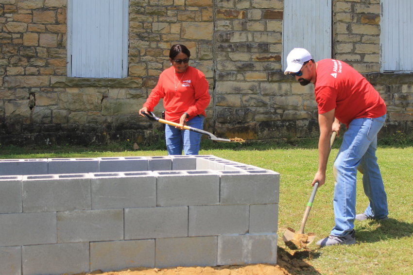 A group of Alabama Power Company employees spent Earth Day building two raised bed gardens at the Free Will Baptist Children's Home in Eldridge.