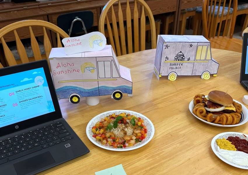 Students in Heather Harrison's family and consumer science classes at Dora High School were tasked with making dishes inspired by their food truck concepts last week. Students crafted food trucks out of paper and other materials, created digital logos and menus, and cooked dishes that were on display for a host of judges.