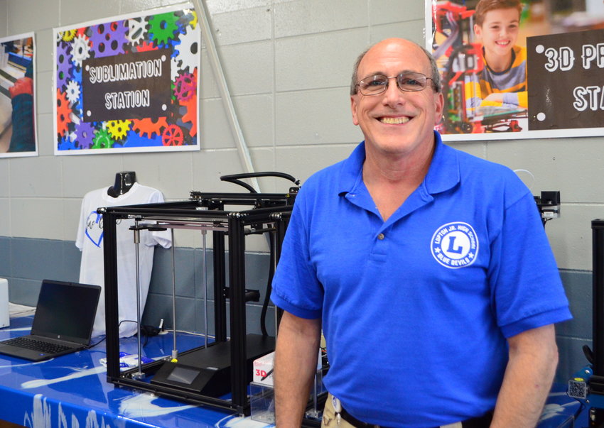 Don Johnson helps to oversee the STEM lab at Lupton Jr. High School. He is pictured in front of a 3D printer at the school.