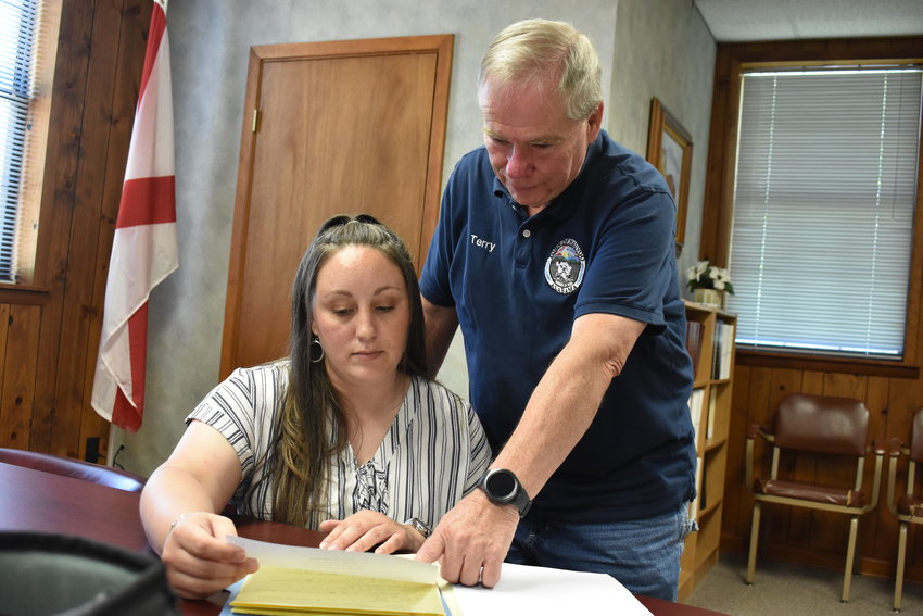 Nauvoo Mayor Terry Burgett gives instruction to Nicole Byars recently at Nauvoo Town Hall. Byars said Burgett, who was appointed mayor in February, is fair and listens to all sides before making a decision.