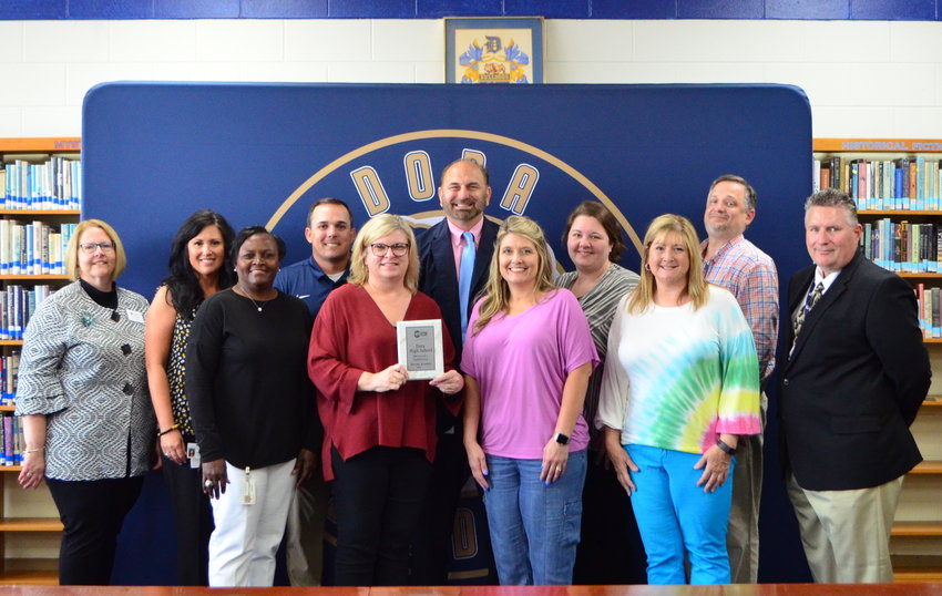 Leaders from the Walker County Board of Education and members of Dora High School's leadership team for the Marzano High Reliability Schools program are pictured on Monday.
