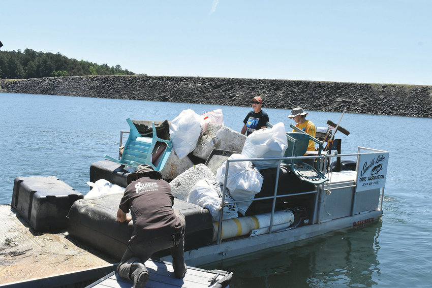 The Smith Lake Civic Association had 20 volunteers to help with the annual spring cleanup in 2019, as seen here, the last full cleanup before the pandemic. A full cleanup, with help from Alabama Power, needs volunteers to help out on May 17-18.