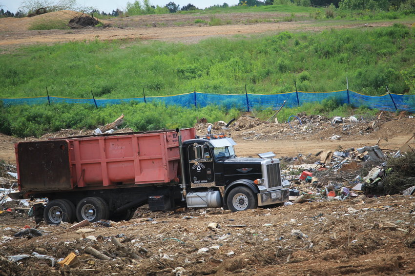 A recycling truck moves through the spot at the Jasper landfill where debris is initially unloaded. Not covering up debris on a weekly basis as required is one of the issues that the Alabama Department of Environmental Management listed as a concern in a recent warning letter regarding operations at the landfill.
