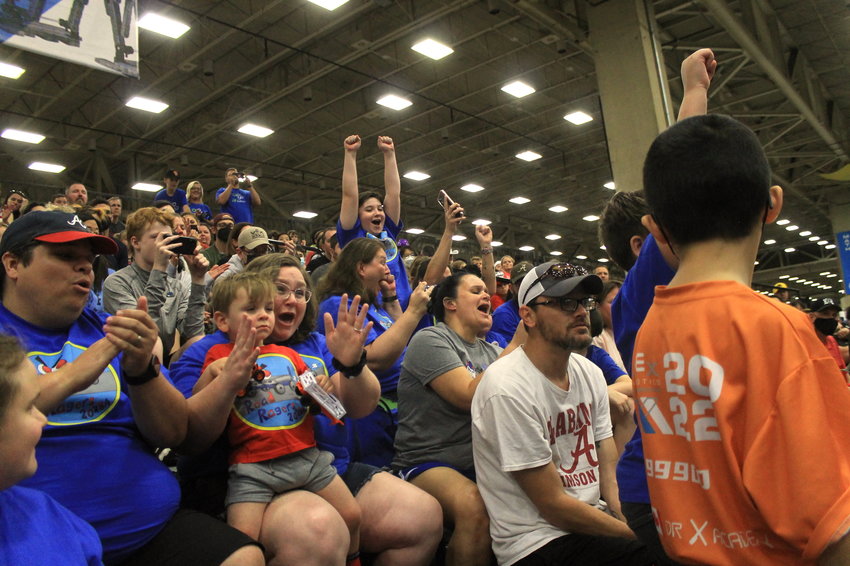 Team members of Blue Devil Robotics' Road Ragers and their families react to the news that the team had won their division's Sportsmanship Award at the VEX Robotics World Championship on May 12 in Dallas, Texas.