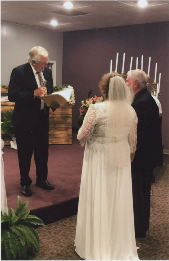 Kenneth Wiggins performing Bill and Sharon's renewing of their vows.