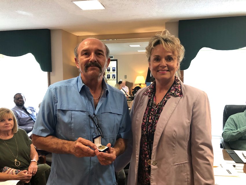 David Key is pictured receiving a pin to recognize his years of service with Jasper City Schools.