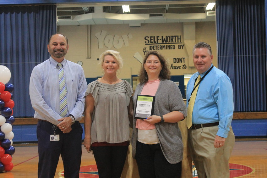 Bankhead Middle School's Amber Parsons, second from right, was announced as the recipient of the 2022 Terry Marbut Excellence in Robotics Teaching Award on Wednesday. Also pictured are Walker County Schools Superintendent Dr. Dennis Willingham, BMS Principal Amber Freeman and Steve Rowe of the Walker County school system.