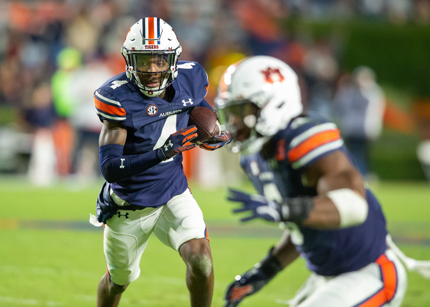 Auburn Tigers cornerback D.J. James (4) intercepts a pass and returns it for a touchdown during the second half of Saturday&rsquo;s NCAA football game, at Jordan-Hare Stadium in Auburn AL. Daily Mountain Eagle -  Jeff Johnsey