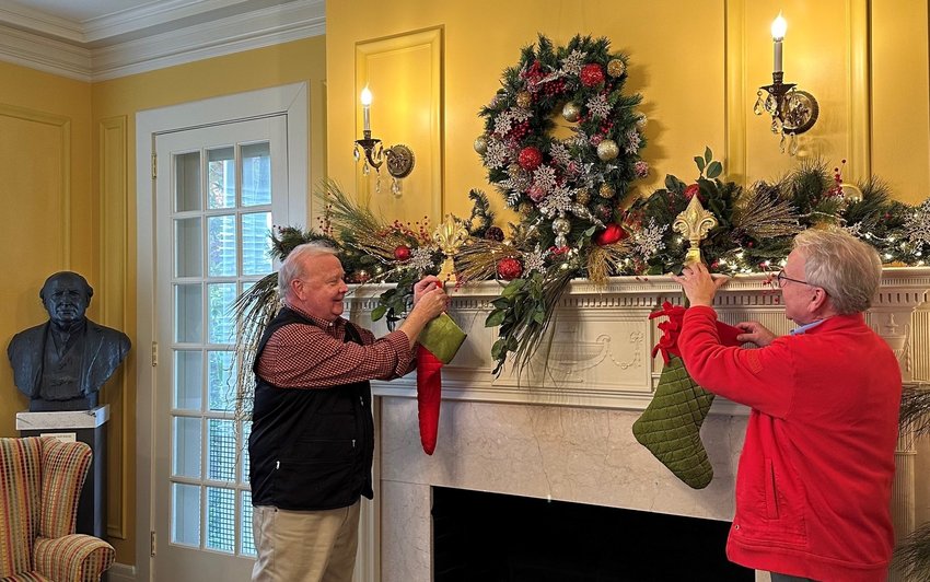 Eddie Brown and Gary Brown recently started decorating the Bankhead House and Heritage Center for the Christmas holidays.