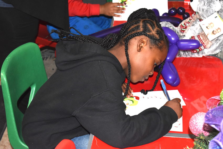 This child writes a letter to Santa at the 2021 Christmas on Main Street. The event returns to Sumiton on Dec. 2.