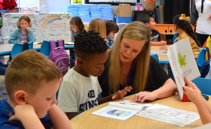 Some schools in Walker County are celebrating achieving level one certification in the Marzano Resources program. Pictured is Parrish Elementary Reading Specialist Amie White working with a student at the school. Parrish was recently named a High Reliability School through the Marzano Resources program.
